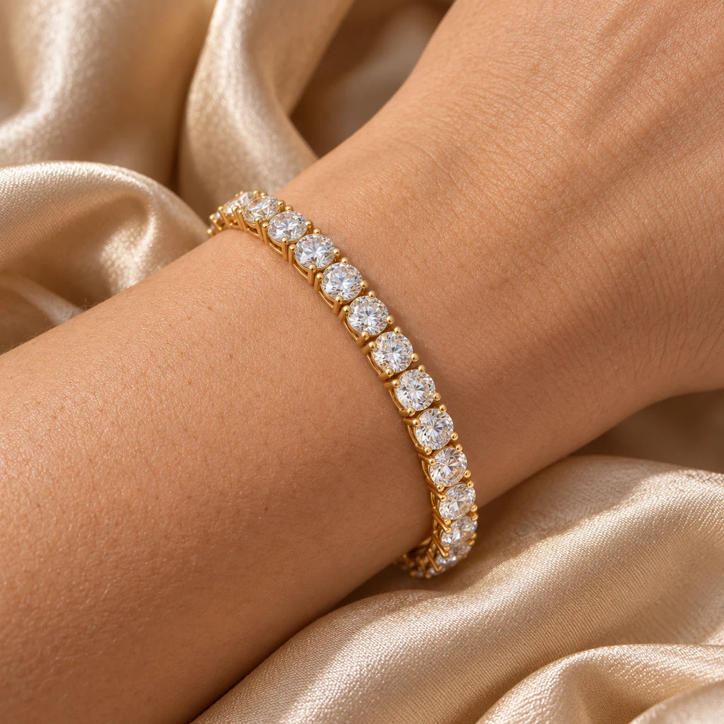 Close-up of the gold moissanite tennis bracelet on satin