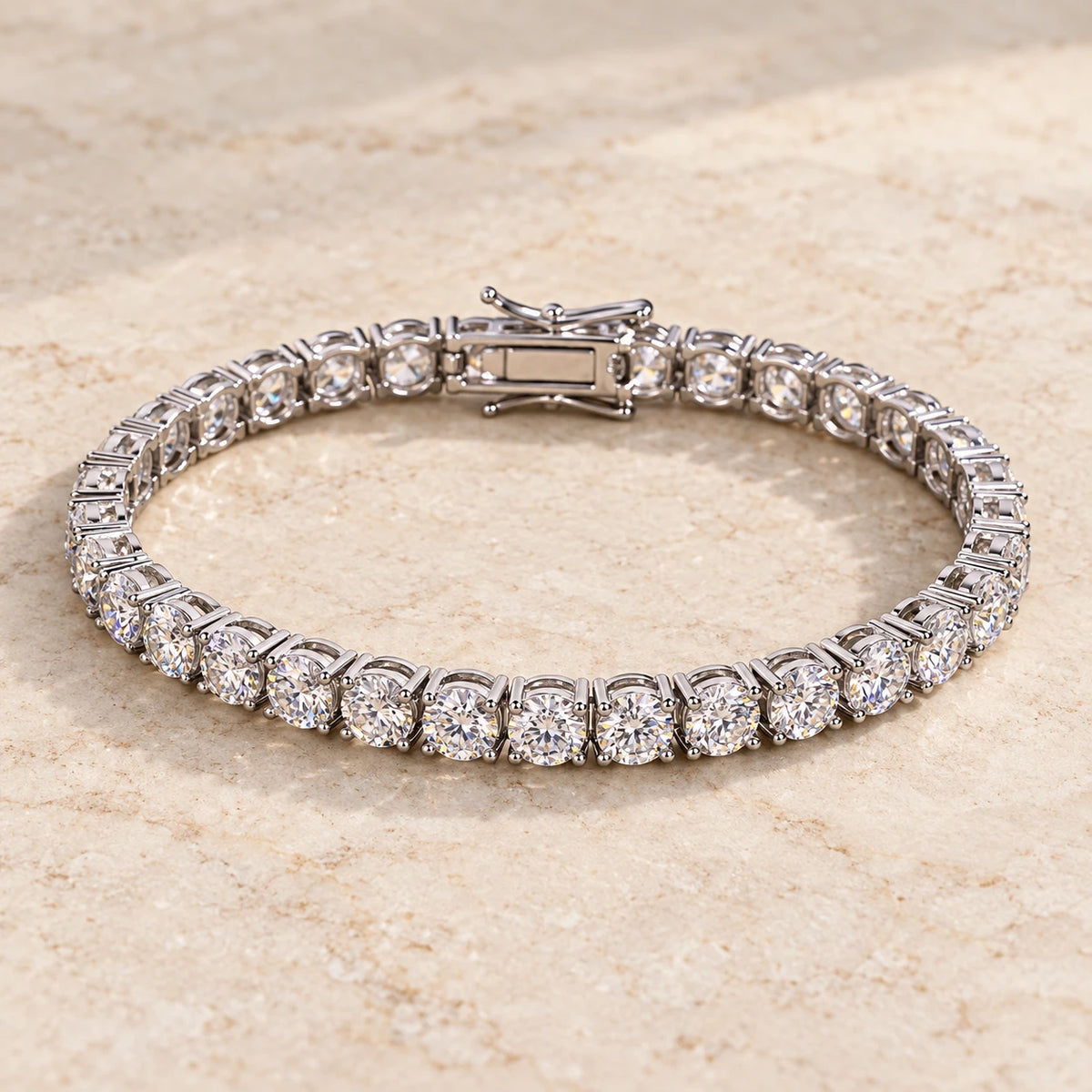 Eclavine 5mm moissanite tennis bracelet in silver, laid flat on stone